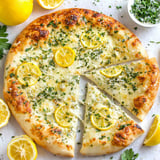 A slice of pizza with lemon on top.