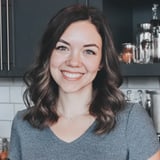Sarah smiling in front of a kitchen counter.